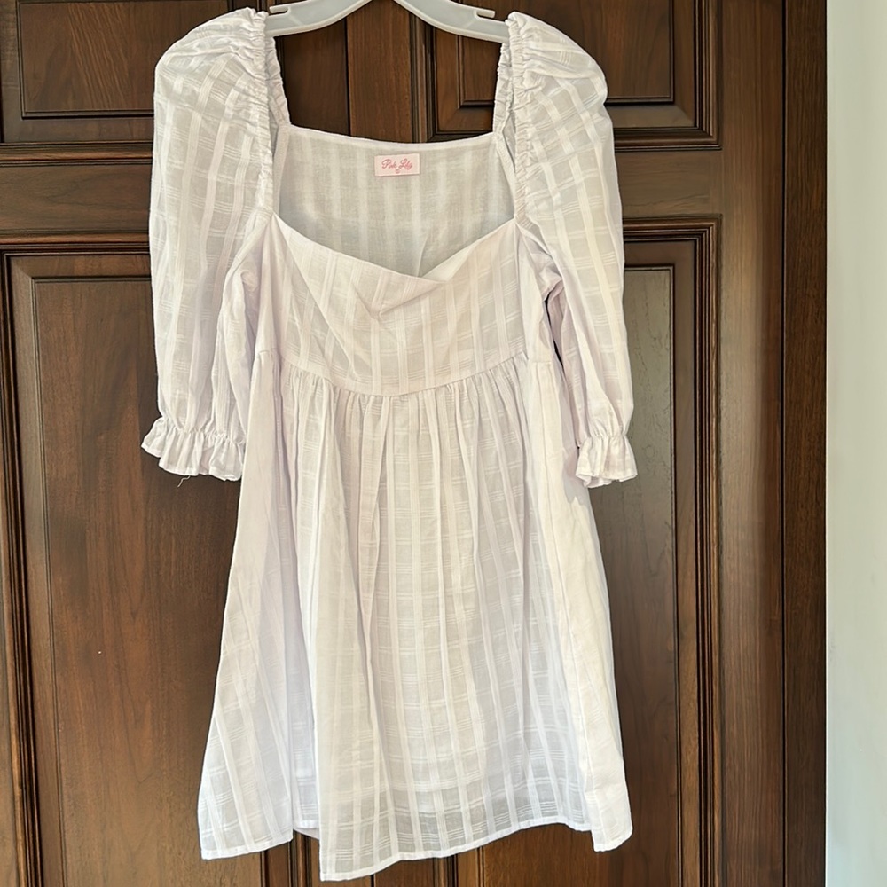 Adorable white plaid babydoll dress. Size small. NEVER WORN.